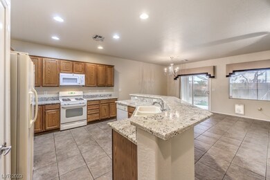 The kitchen overlooks the dining room and Greatroo