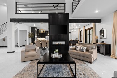 Living room featuring stairs, light tile patterned