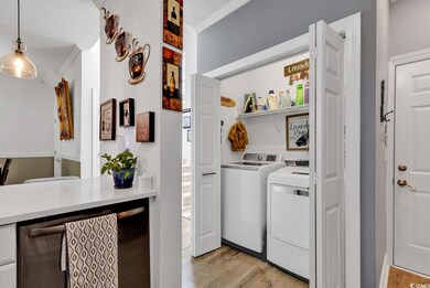 Laundry area featuring light hardwood / wood-style