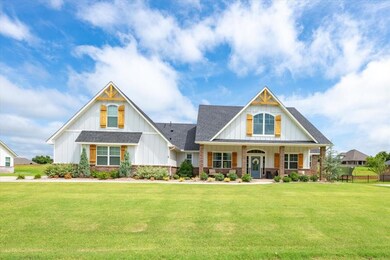 View of front of house featuring a shingled roof, 