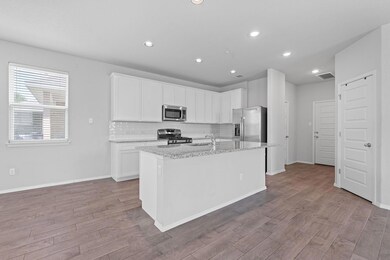 Living area with stairway, wood finished floors, 