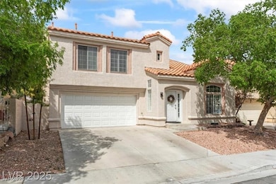 Mediterranean / spanish-style house with driveway, stucco siding, a garage, and a tiled roof