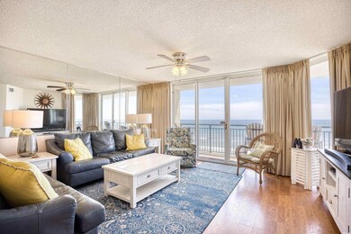 Living room with a textured ceiling, floor to ceil