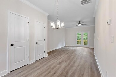 Unfurnished room with ceiling fan with notable cha