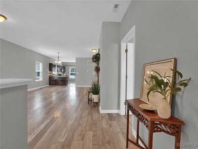View from foyer looking into open living and dinin