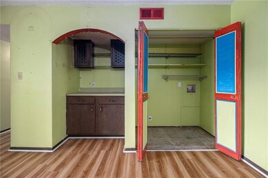 Laundry room featuring washer hookup and light wood-type flooring