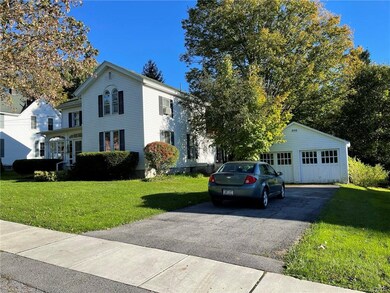 Large village lot with two driveways and detached 