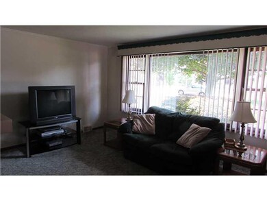 Living Room. Bright and Sunny Triple Picture Windo