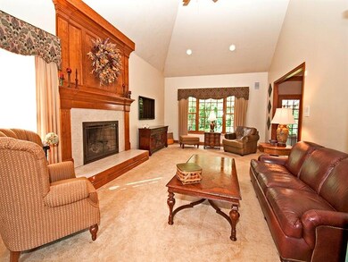 Spacious and cozy family room boasts cathedral cei