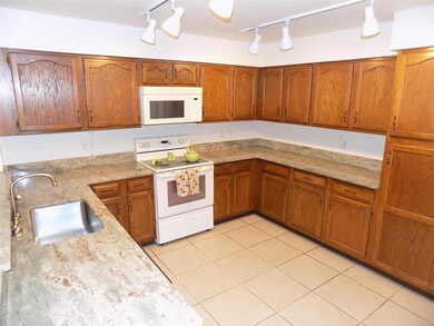 Cabinets galore and beautiful stone countertop