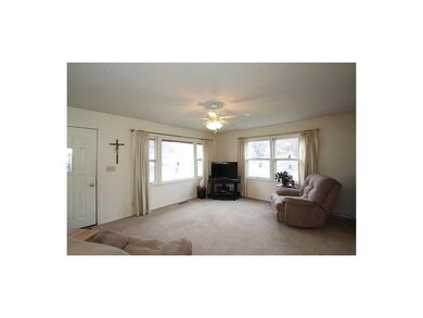 Living Room. Large living room windows provide lot