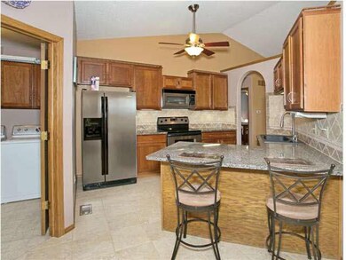 Also note handy laundry room just off the kitchen.