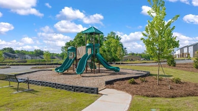 View of play area with a yard