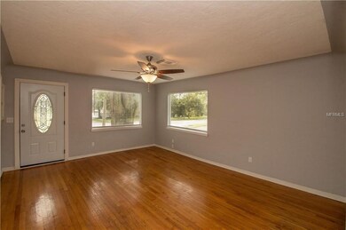 Hardwood floors in Living Room with Cove Ceiling