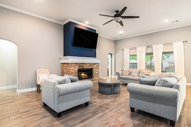 The spacious open concept family room has high cei