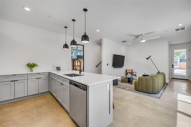 Kitchen with a sink, stainless steel dishwasher, 