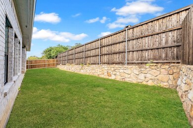 View of fenced backyard
