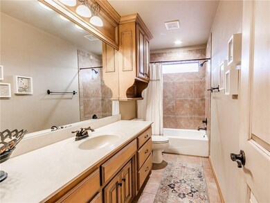 Guest bath with tons of storage and natural light.