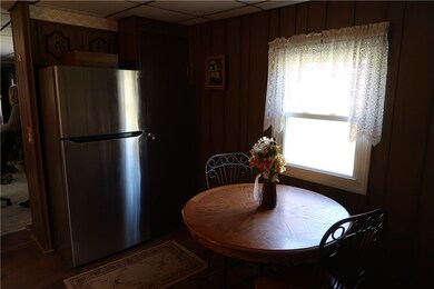 Eat-in kitchen with stainless steel refrigerator