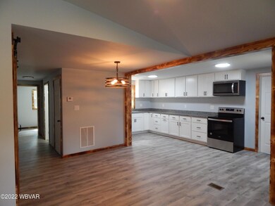 Looking into the dining area & kitchen