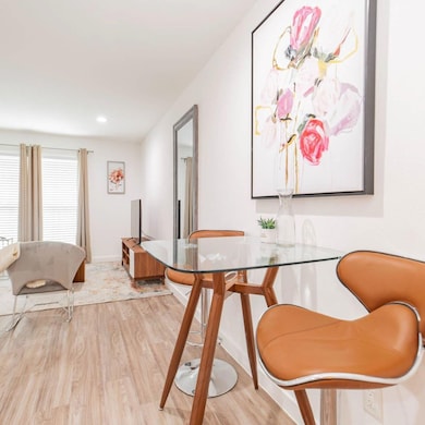 Dining room featuring recessed lighting, light woo