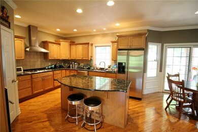 Gorgeous kitchen with granite counter tops, cerami