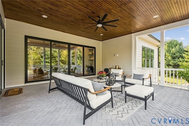 View of patio / terrace with a ceiling fan and an outdoor hangout area