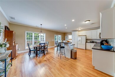 Kitchen featuring a breakfast bar area, tasteful b