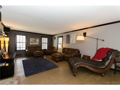 Oversized living room with fireplace.