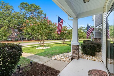 View of yard featuring covered porch