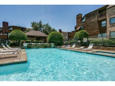 Community pool with a patio