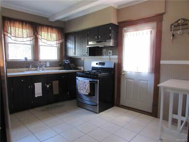 Kitchen and back door leading out to the back deck