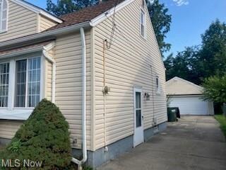 View of side of property featuring garage