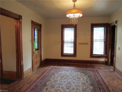 The dining room with pine plank flooring has flute