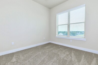 Primary bedroom with large window