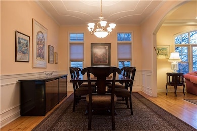 Dining room features architectural details with pl