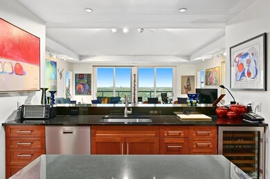 Kitchen featuring stainless steel dishwasher, a s