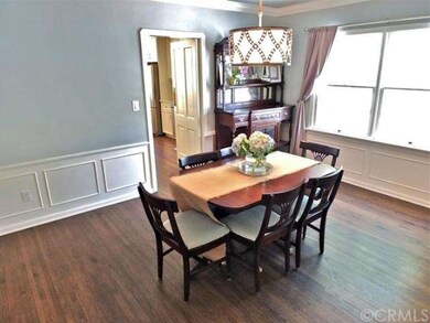 Formal dining room with door to kitchen.  