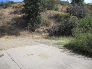 BOULDER CREEK ROAD WITH CONCRETE APRON WHICH THE B