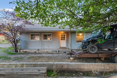 View of front of house featuring a porch and roof with shingles