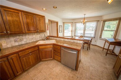 Custom cherry kitchen with granite tops.