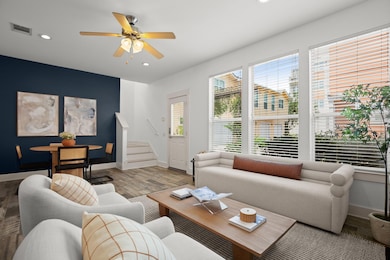 Living area with wood finished floors, recessed l