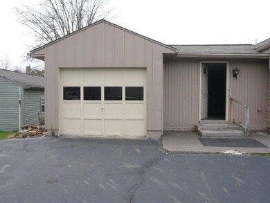 Deep one car garage with automatic opener.