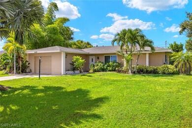 Single story home with a garage and a front yard