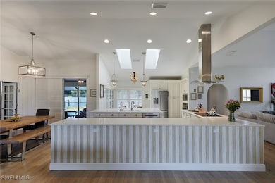 Kitchen featuring a chandelier, light countertops,