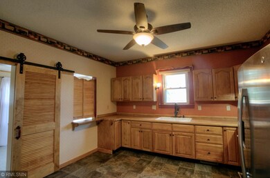 Large Kitchen with window overlooking deck and bac