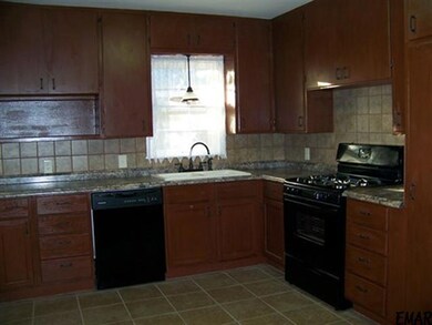 New bottom cabinets, cabinet tops, sink, faucets, 
