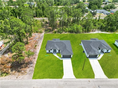View from above of property featuring a tree filled landscape