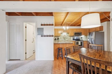 Kitchen with stainless steel appliances, beam ceil