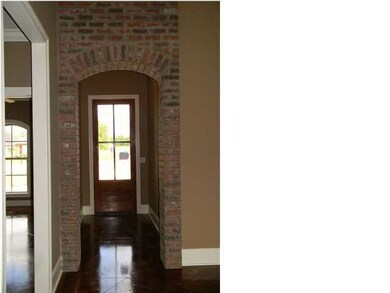View of foyer with brick archway